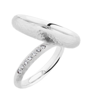 Christian Bauer 280198 18 karat white gold wedding band, angled view of a domed profile with a hammered surface of visible dimples above a bright polished interior, shown with its matching ring