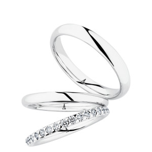 Christian Bauer 280227 14 karat white gold wedding band, angled view of a polished rounded profile with a soft edge break and a bright polished interior, shown with its matching rings