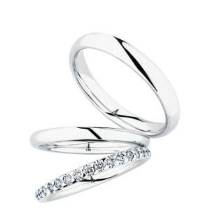 Christian Bauer 280227 platinum wedding band, angled view of a polished rounded profile with a soft edge break and a bright polished interior, shown with its matching rings