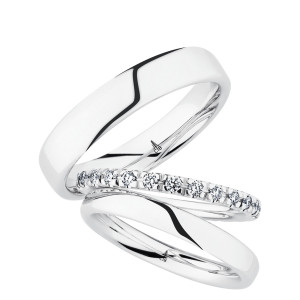 Christian Bauer 280230 14 karat white gold wedding band, angled view of a gently domed polished face with rounded edges running into a bright polished interior, shown with its matching rings