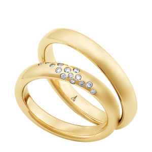 Christian Bauer 280234 18 karat yellow gold wedding band, angled view of a round dome with a soft satin surface and no edge treatment, the interior polished, shown with its matching ring