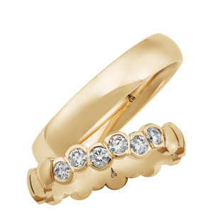 Christian Bauer 280252 14 karat yellow gold wedding band, angled view of a softly domed polished profile with rounded edges and a mirror polished interior, shown with its matching ring