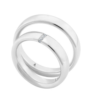 Christian Bauer 280253 14 karat white gold wedding band, angled view of a flat polished face with softly rounded edges, the surface unbroken into a polished interior, shown with its matching ring