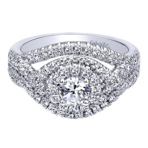 Gabriel & Co. ER910093W44JJ 14 karat white gold Contemporary engagement ring, top view of the round center in a round double halo with pave arms curving around it