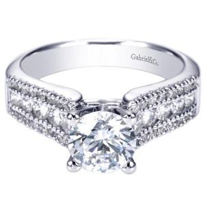 Gabriel & Co. ER3952W44JJ 14 karat white gold Contemporary engagement ring, front view of a round center flanked by a large stone row between two finer beaded rows