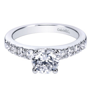 Gabriel & Co. ER3950W44JJ 14 karat white gold Contemporary engagement ring, front view of the round center on four prongs beside a graduated shared prong row