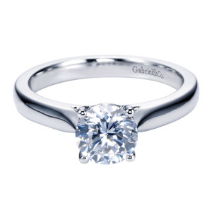 Gabriel & Co. ER6645PTJJJ platinum Contemporary engagement ring, front view of the round center on rounded prong tips above a narrowing shank