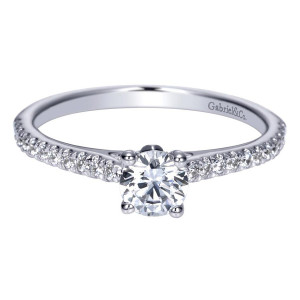 Gabriel & Co. ER98509W44JJ 14 karat white gold Contemporary engagement ring, angled view of the round center raised on four prongs above a pave lined shoulder