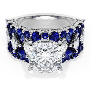 21CU9BS312 Platinum top view, cushion center stone above a wide band of blue sapphires with white accent diamonds