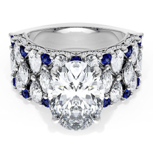 21OV125X9BS112W top view, oval center stone on wide white metal band with marquise diamonds and round blue sapphires