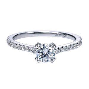 Gabriel & Co. ER97709W44JJ 14 karat white gold Contemporary engagement ring, front view of a round solitaire center held by doubled prongs above a pave lined shank