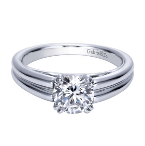 Gabriel & Co. ER8136PTJJJ platinum Contemporary engagement ring, front view of the round center held by doubled prong tips above grooved shoulders
