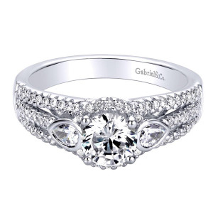 Gabriel & Co. ER9299W44JJ 14 karat white gold Contemporary engagement ring, front view of a round center flanked by two bezel set pear side stones