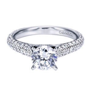 Gabriel & Co. ER7538W44JJ 14 karat white gold Contemporary engagement ring, front view of the round center above a domed shank paved in several tapering rows