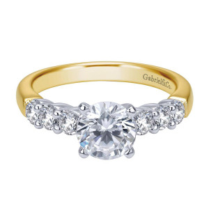 Gabriel & Co. ER7849M44JJ two-tone 14 karat gold Contemporary engagement ring, front view of the round center above shared prong round stones graduating along the shoulders