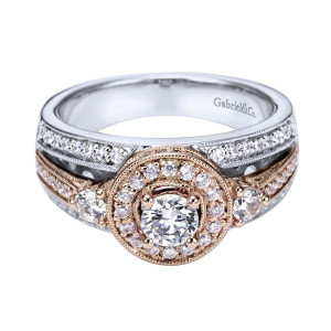 Gabriel & Co. ER94032T44JJ two-tone 14 karat gold Victorian engagement ring, angled view of a round center in a milgrain edged domed halo between two larger side rounds