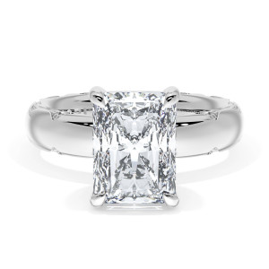 4144RAD95X7 Platinum top view, radiant cut center on a wide polished band with milgrain crescents