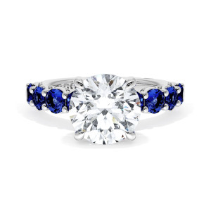 415RD9BS Platinum top view, round brilliant center on a band of round blue sapphires in milgrain pockets