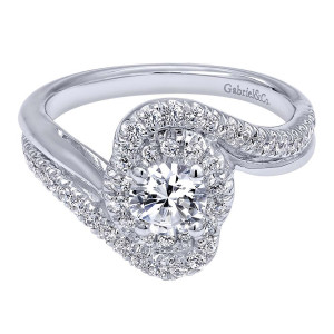 Gabriel & Co. ER910084W44JJ 14 karat white gold Contemporary engagement ring, front view of a round center wrapped by a swirled halo between bypassing pave arms
