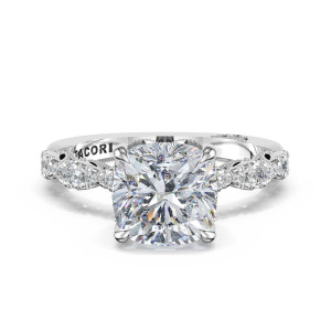 482CU Platinum ring, top view of cushion cut center on a pierced band with milgrain leaf cutouts
