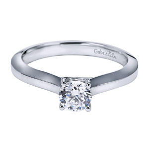 Gabriel & Co. ER6610PTJJJ platinum Contemporary engagement ring, front view of the round center gripped by four fine prongs between gently tapering polished shoulders