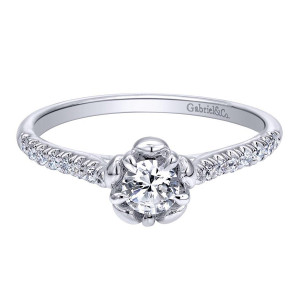 Gabriel & Co. ER910160W44JJ 14 karat white gold Contemporary engagement ring, angled view of the round center held in curled petal prongs above slender pave shoulders