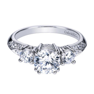 Gabriel & Co. ER3822W44JJ 14 karat white gold Victorian engagement ring, angled view of the three stone layout with milgrain edged pave shoulders tapering rearward