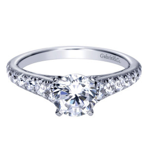 Gabriel & Co. ER8259W44JJ 14 karat white gold Contemporary engagement ring, front view of the round center flanked by graduated stones shrinking down the tapering shank