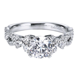 Gabriel & Co. ER5329W44JJ 14 karat white gold Contemporary engagement ring, front view of the round center flanked by alternating larger stones and small pave clusters