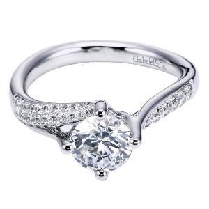 Gabriel & Co. ER6359W44JJ 14 karat white gold Contemporary engagement ring, angled view from above of bypass arms sweeping past the center in pave rows