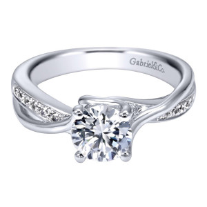 Gabriel & Co. ER6360W44JJ 14 karat white gold Contemporary engagement ring, angled view of the round center in four prongs above crossing polished and bead set rails