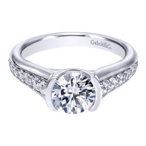 Gabriel & Co. ER10428W44JJ 14 karat white gold Contemporary engagement ring, front view of the round center held in a half bezel between graduated shoulder rows