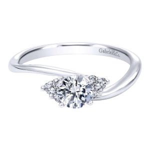 Gabriel & Co. ER910073W44JJ 14 karat white gold Contemporary engagement ring, front view of the round center flanked by small accent clusters on a swept bypass shank