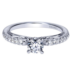 Gabriel & Co. ER98596W44JJ 14 karat white gold Contemporary engagement ring, angled view of the round center in four prongs above pave shoulders and pierced scrollwork