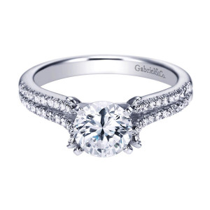 Gabriel & Co. ER7274W44JJ 14 karat white gold Contemporary engagement ring, angled view of the round center in paired prongs with tiny accents at their bases