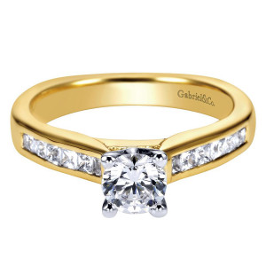 Gabriel & Co. ER3965M44JJ two-tone 14 karat gold Contemporary engagement ring, front view of the round center above channel set square stones along both shoulders