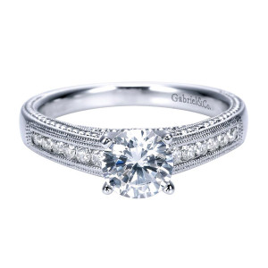 Gabriel & Co. ER7996W44JJ 14 karat white gold Victorian engagement ring, top view of the channel set rows running down a broad shank toward the round center