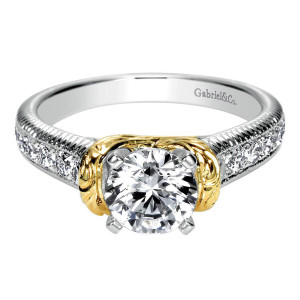 Gabriel & Co. ER9238M44JJ two-tone 14 karat gold Contemporary engagement ring, front view of a round center in four prongs, carved scroll collar wrapping the shoulders