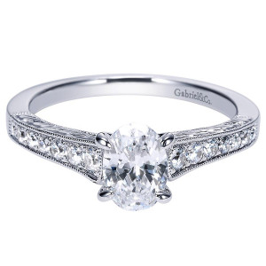 Gabriel & Co. ER8805W44JJ 14 karat white gold Victorian engagement ring, angled view of the oval center lifted above bead set shoulders with milgrain borders