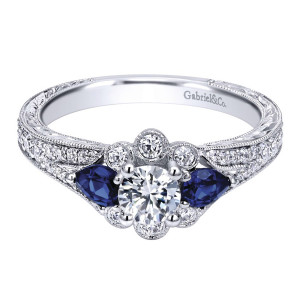 Gabriel & Co. ER910222W44SA 14 karat white gold Victorian engagement ring, front view of the round center flanked by two blue pear stones between bezel set accents