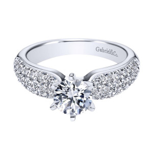 Gabriel & Co. ER3899W44JJ 14 karat white gold Contemporary engagement ring, front view of the round center in six prongs above three pave rows across the shoulders