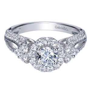 Gabriel & Co. ER98583W44JJ 14 karat white gold Contemporary engagement ring, angled view of the round center in a single halo flanked by clustered side stones