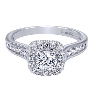 Gabriel & Co. ER910136W44JJ 14 karat white gold Contemporary engagement ring, top view of the round center in a single cushion halo above channel set shoulder stones