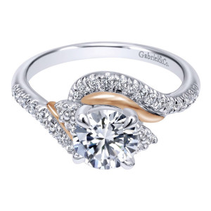 Gabriel & Co. ER10304T44JJ two-tone 14 karat gold Contemporary engagement ring, angled view of a round center with a smooth ribbon curling between two pave sweeps