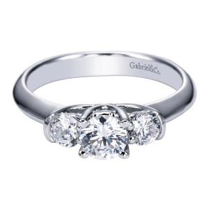 Gabriel & Co. ER93942W44JJ 14 karat white gold Contemporary engagement ring, front view of a round center between two round side stones on a plain tapering shank