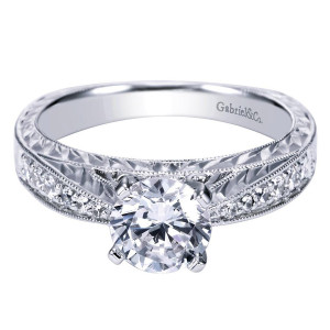 Gabriel & Co. ER4177W44JJ 14 karat white gold Victorian engagement ring, front view of the round center prong set above an engraved panel between pave rails