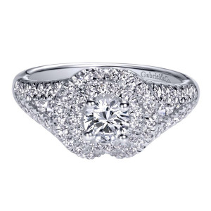 Gabriel & Co. ER910146W44JJ 14 karat white gold Contemporary engagement ring, angled view of the round center ringed by two halo rows above swirled pave shoulders
