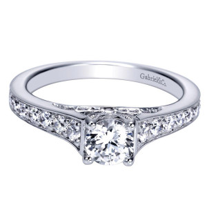 Gabriel & Co. ER98627W44JJ 14 karat white gold Contemporary engagement ring, front view of the round center over shoulders of graduated stones between beaded rails