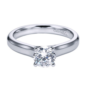 Gabriel & Co. ER6580PTJJJ platinum Contemporary engagement ring, front view of a round center in four prongs above narrow shoulders that flare slightly