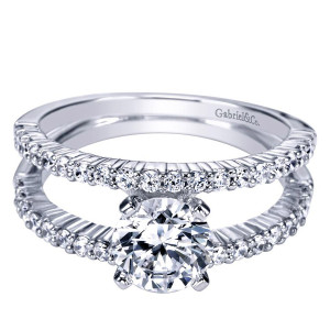 Gabriel & Co. ER4233W44JJ 14 karat white gold Contemporary engagement ring, angled view of the round center held low between two open prong set rails